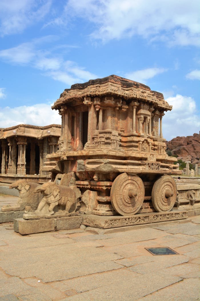 gallery-6 Explore the iconic Stone Chariot at Vittala Temple in Hampi, a stunning example of Indian architectural heritage.