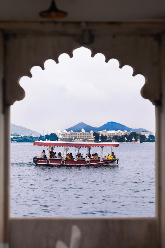 about-02 A framed view of a boat on Lake Pichola, Udaipur, India.