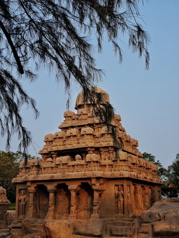 our-experience Historic stone temple with intricate carvings in Mahabalipuram, showcasing ancient architecture.