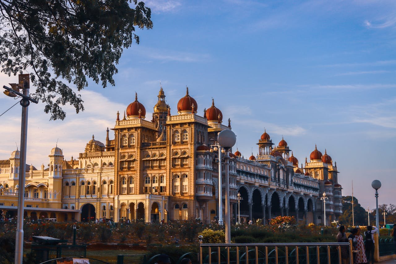 why-choose-us A breathtaking view of Mysore Palace, an iconic landmark in India, captured with architectural grandeur against a clear blue sky.
